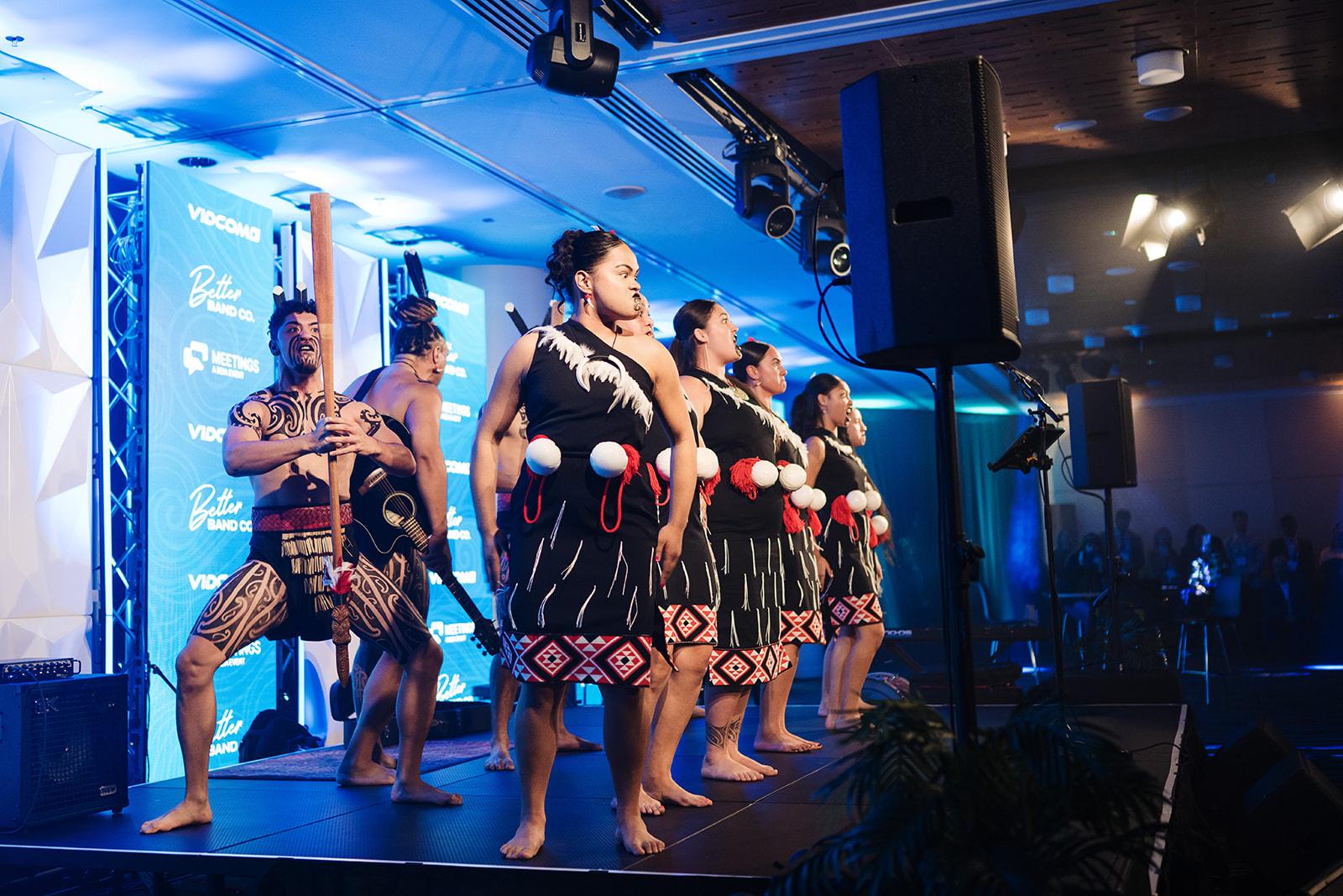 Pōwhiri on stage at the welcome function of MEETINGS 2025