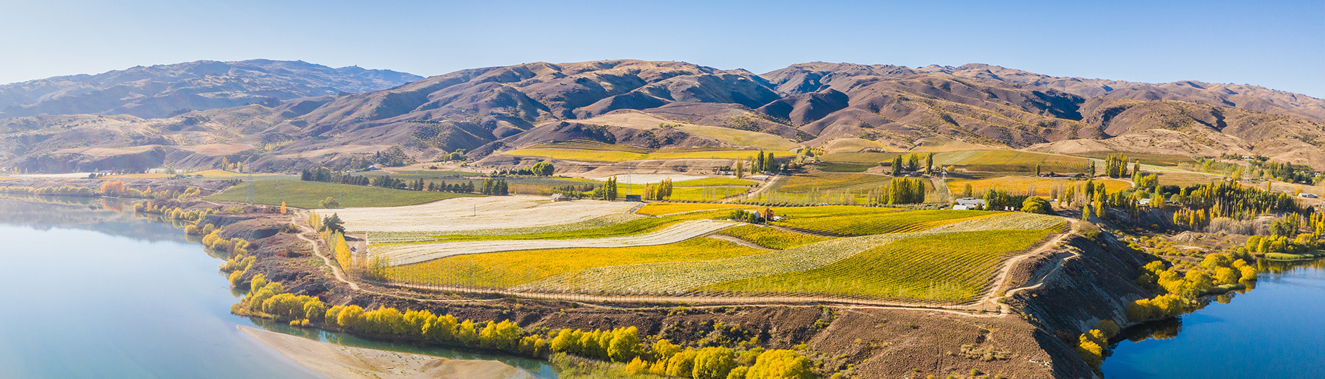 Central Otago mountains with green fields and streams